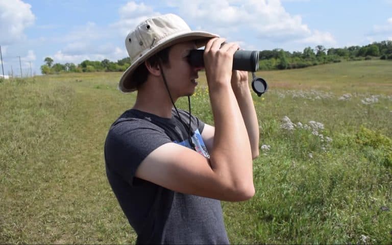 someone is holding a scope